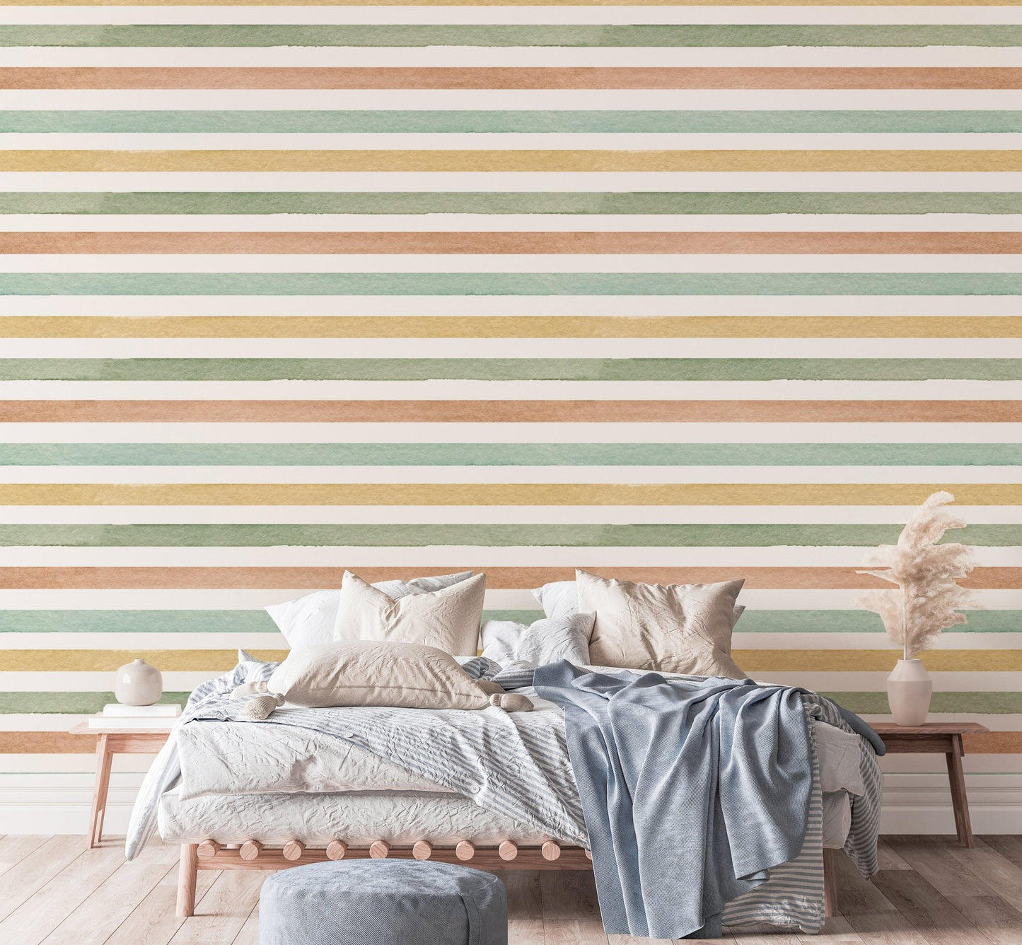 Multi-colour pastel wallpaper mural behind a large bed with neutral pillows