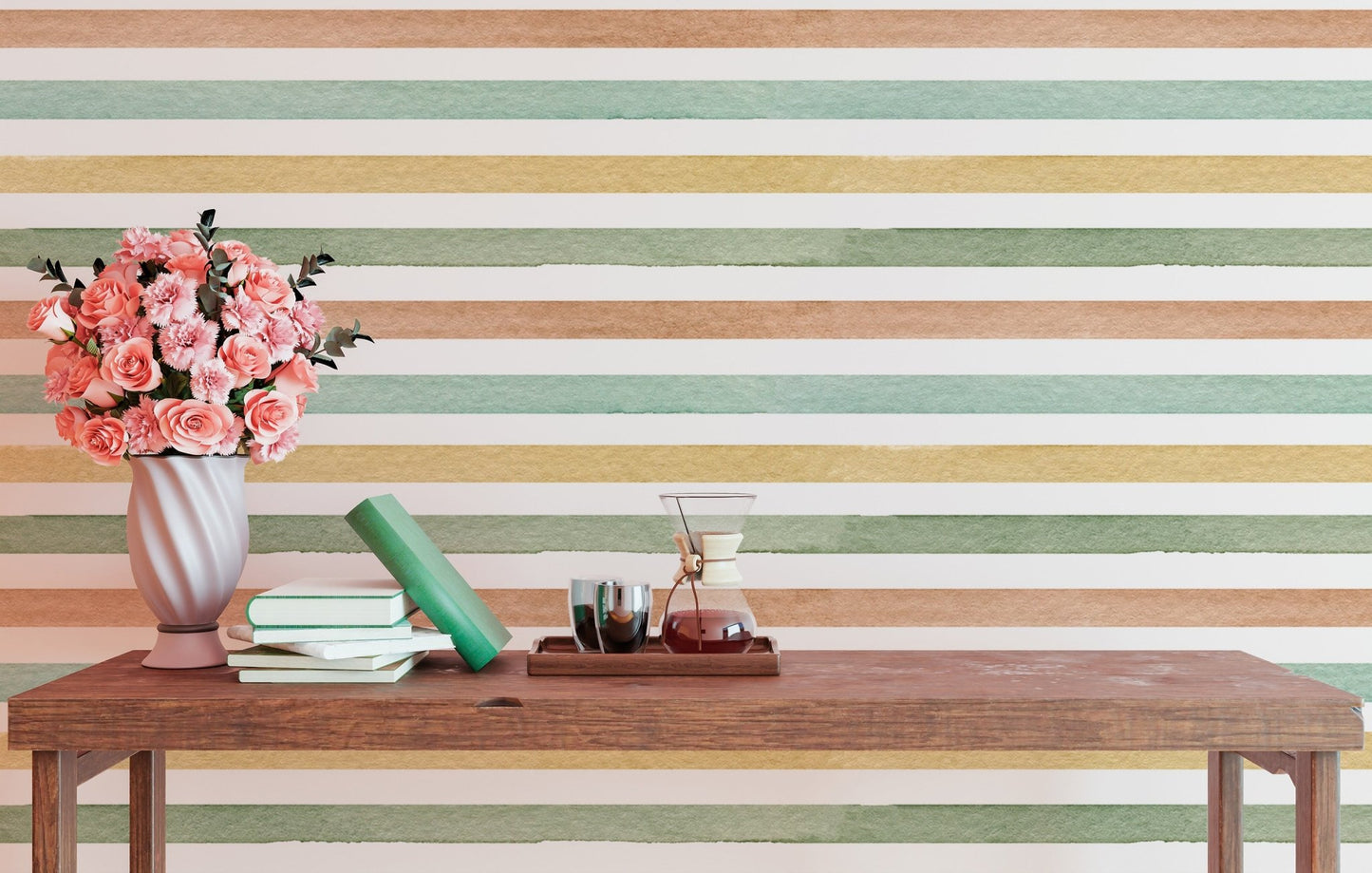 Hand-painted stripe effect wallpaper  behind a wooden bench with pink flowers in a vase.