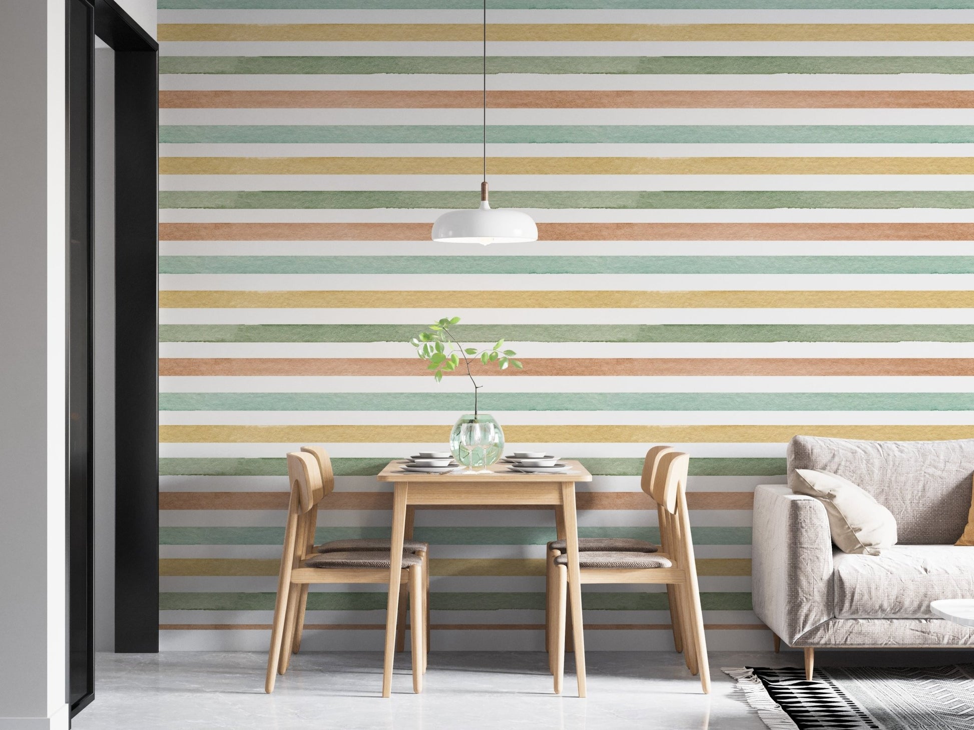 Horizontal striped wallpaper behind a wooden dining table and grey sofa