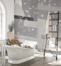 Grey terrazzo bathroom wall mural with white freestanding bathtub.