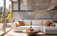 White sofa in a bright living room with concrete texture wall mural.