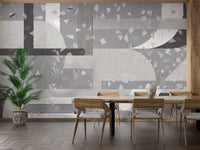 Dining room wall mural featuring abstract grey concrete patterns.