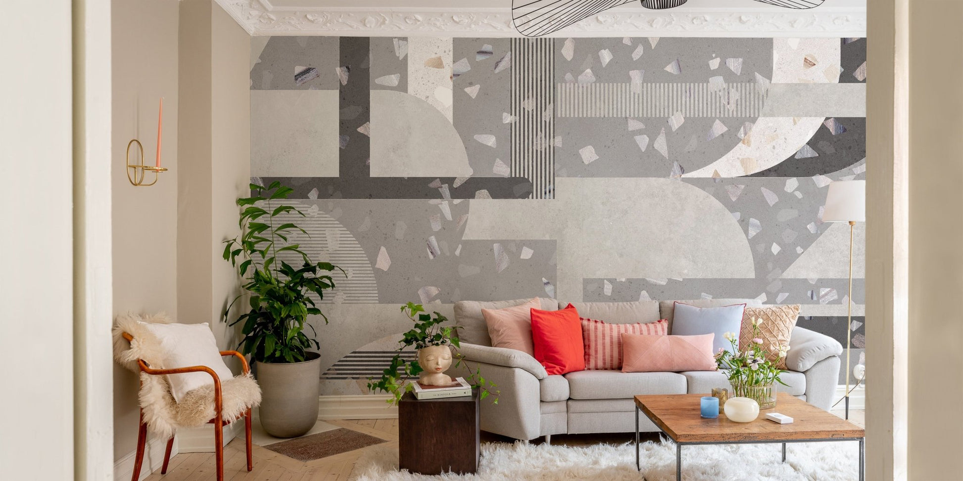 Modern living room wall mural with grey geometric terrazzo design.