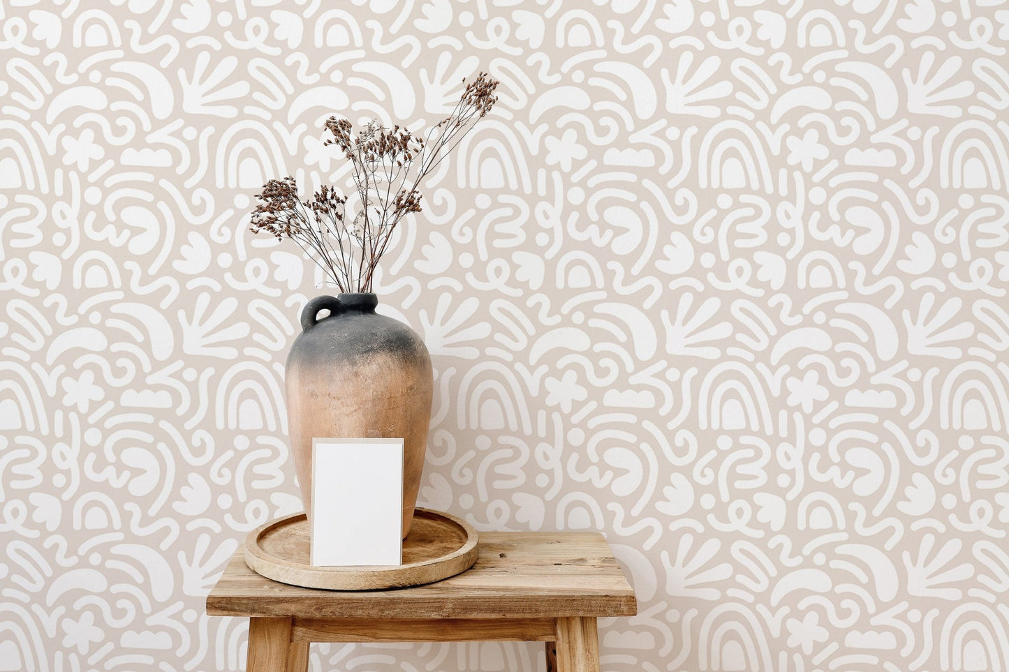 Scandinavian wallpaper design used as a backdrop for ceramic vases.