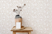 Scandinavian wallpaper design used as a backdrop for ceramic vases.