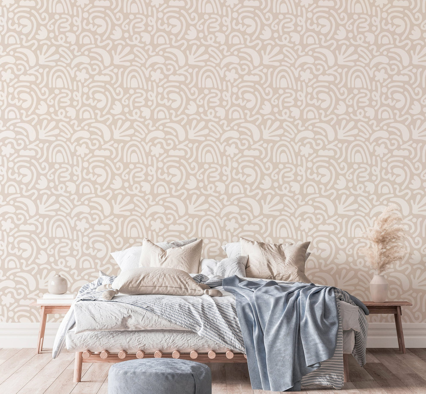 Textured abstract wallpaper in a large bedroom with blue and beige linens.
