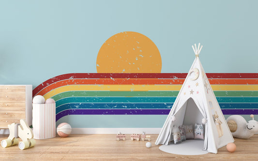 Playroom furniture set against a rainbow bliss wall mural