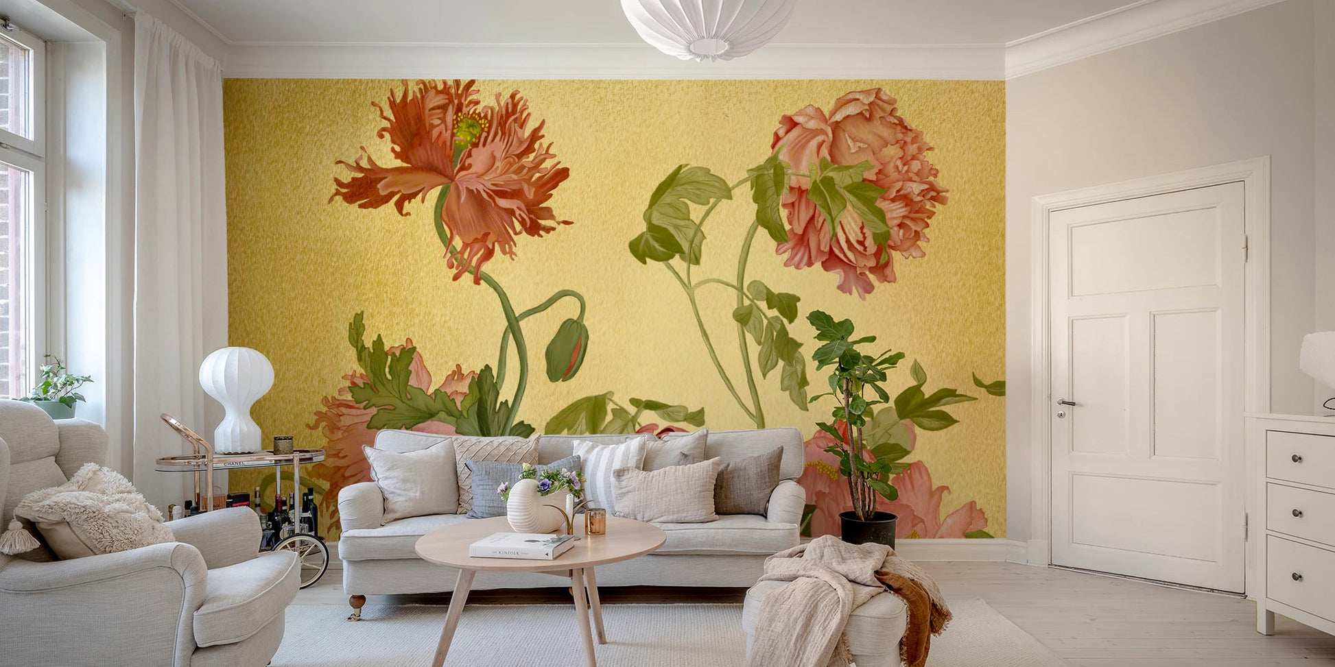 Large scale floral garden wall mural in a living room with a grey sofa and white rug