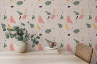 Modern granite pattern wallpaper behind a desk with green leaves in a white vase.