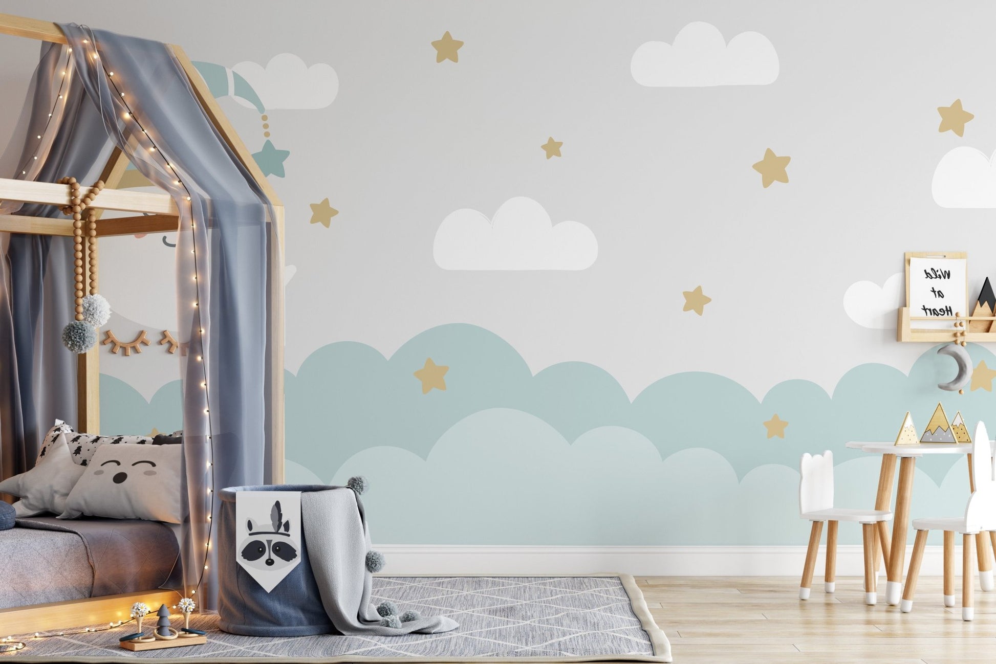 Wall mural featuring a crescent moon and soft, fluffy clouds.
