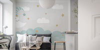 Dreamy mural with crescent moon and clouds for tranquil decor.
