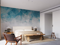 Bedroom wall mural featuring crumbled blue color with wooden bench.