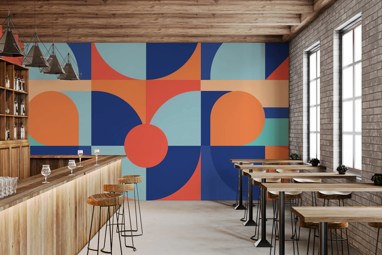 Geometric semi-circle wall mural in a restaurant with wooden tables and bar seating