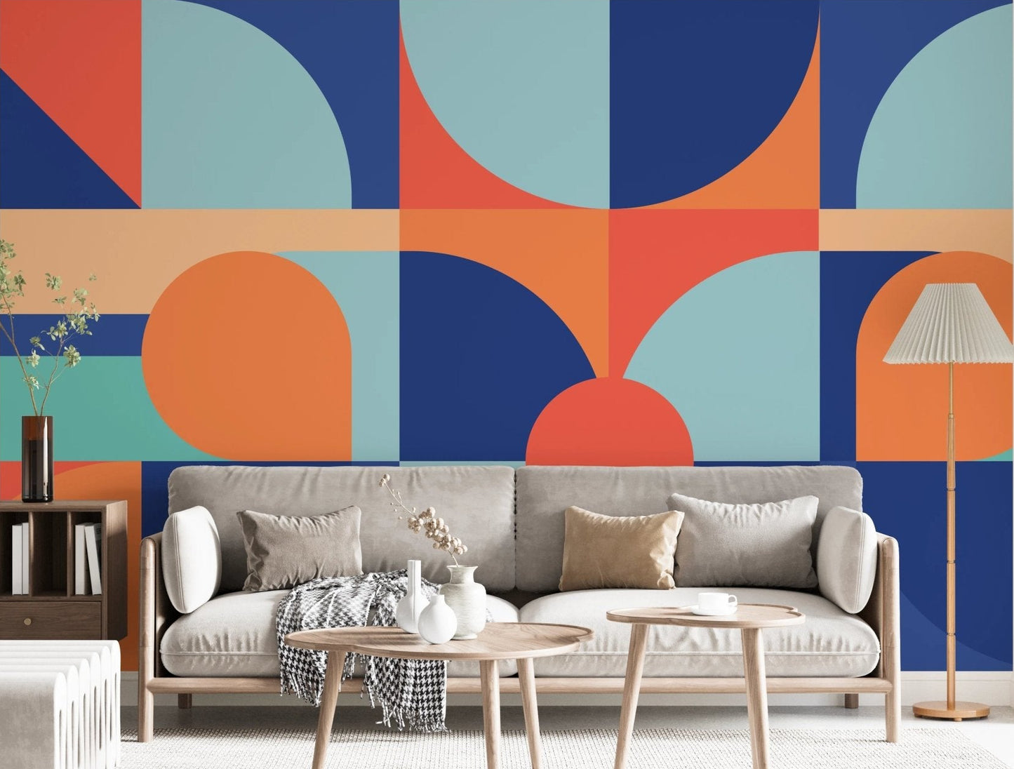 Navy and orange geometric wall mural in a modern living with a grey sofa