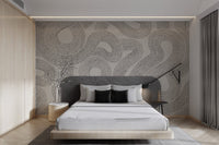 Continuous flowing line wall mural for a minimalist bedroom interior.