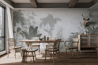 Modern tropical trees and leaves wall mural design in sunlit dining area.