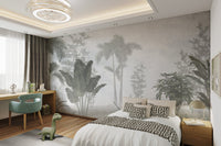Nature-themed wall mural featuring tropical leaves in cozy bedroom.