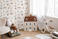 Illustrated animal wallpaper with crocodiles and giraffes for nursery wall.