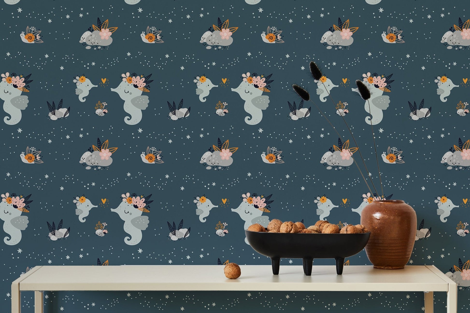 Cute baby sea or ocean animals repeat pattern wallpaper behind a minimalist dining table.