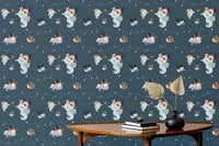 Aquatic animal wallpaper featuring whales and jellyfish behind a wooden desk setup.