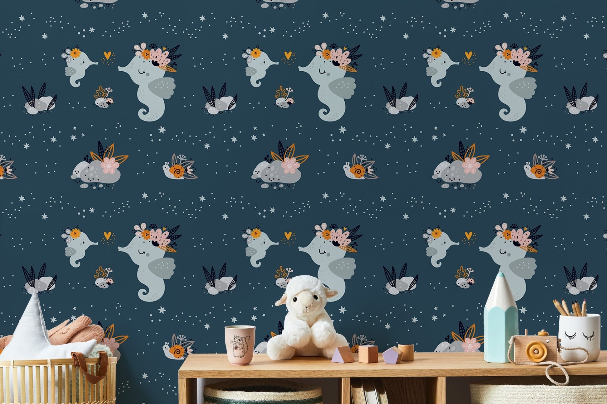 Adorable baby sea animals wallpaper with repeat pattern in playroom.