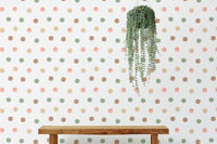Minimalist room featuring a polka dot wallpaper and a simple wooden bench.