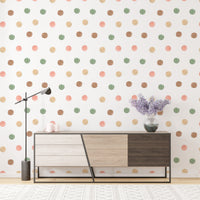 Contemporary sideboard placed against a muted polka dot wallpaper.