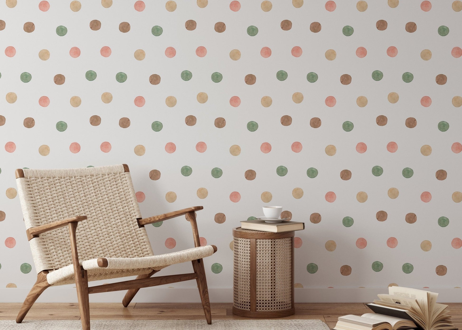 Woven chair next to a wall with earthy watercolor dot wallpaper.