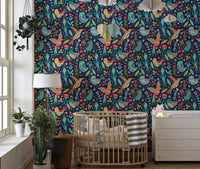 Folk style bird wallpaper in a child's room with a small wooden bed.