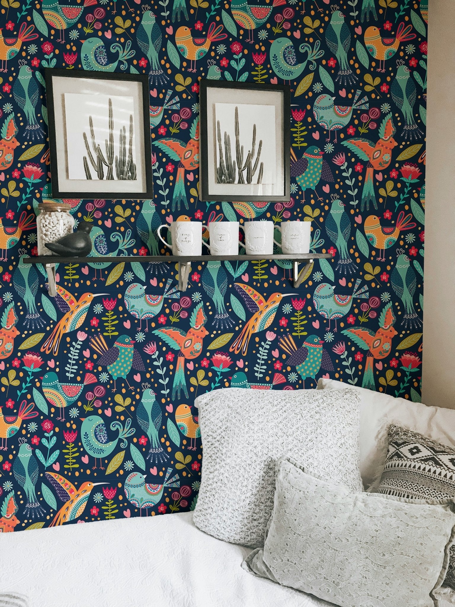 Bird and floral pattern wallpaper behind a white wooden crib in a living room.