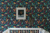 Cartoon bird wallpaper in a bedroom featuring white bedding and natural light.