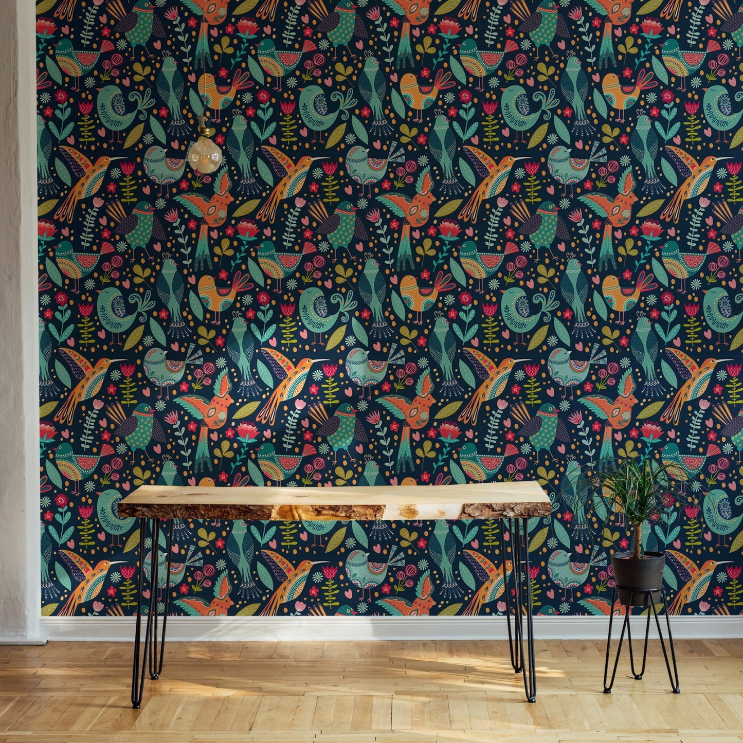 Detailed folk bird wallpaper on a feature wall in a minimalist home office.