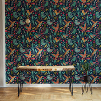 Detailed folk bird wallpaper on a feature wall in a minimalist home office.