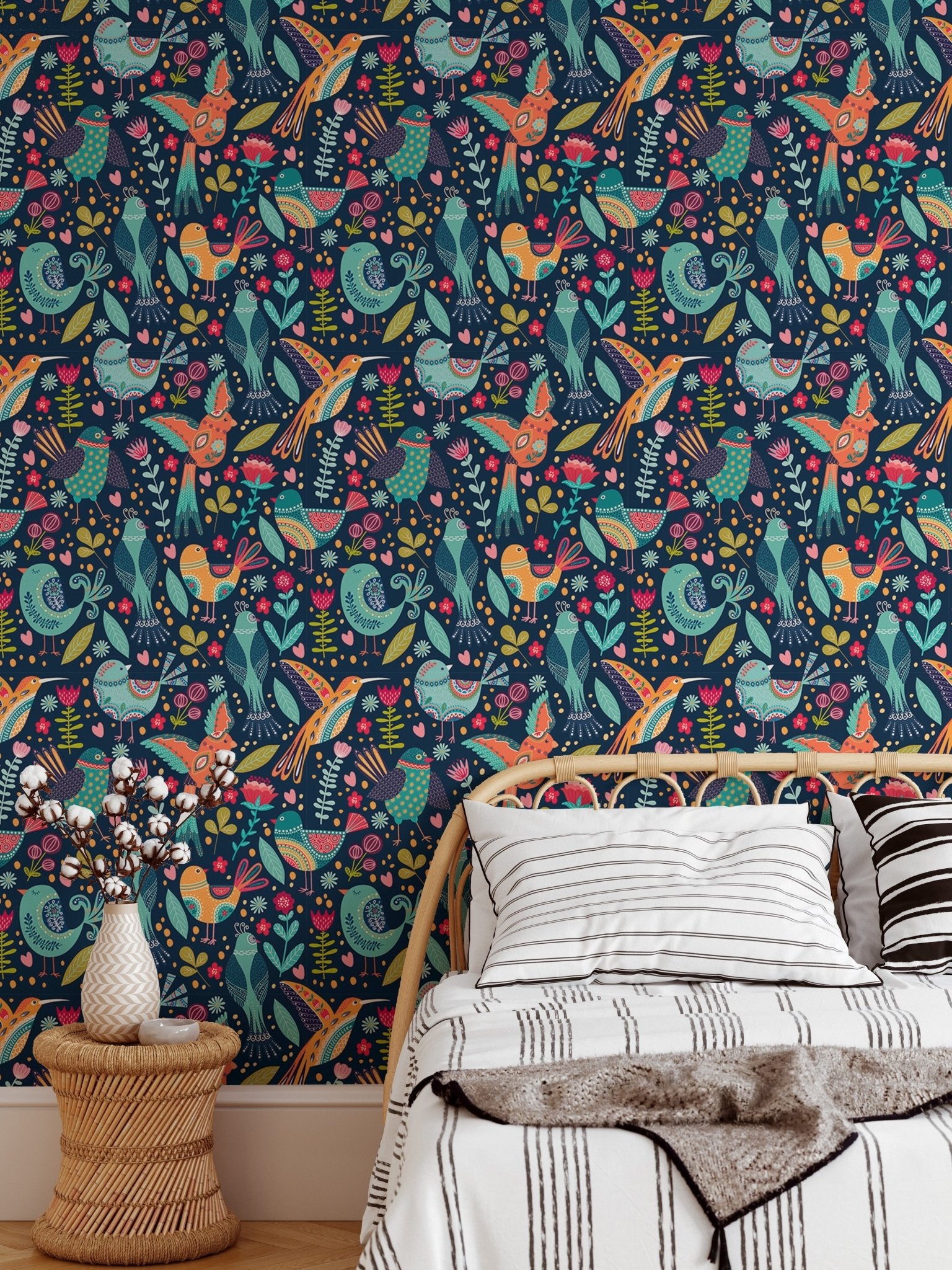 Cute Cartoon Colorful Folk Birds and Flower Wallpaper behind a bed with white pillows.