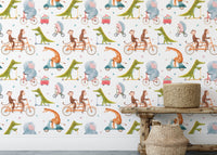 Cartoon crocodile and elephant on bikes wall mural behind a rustic wooden shelf.