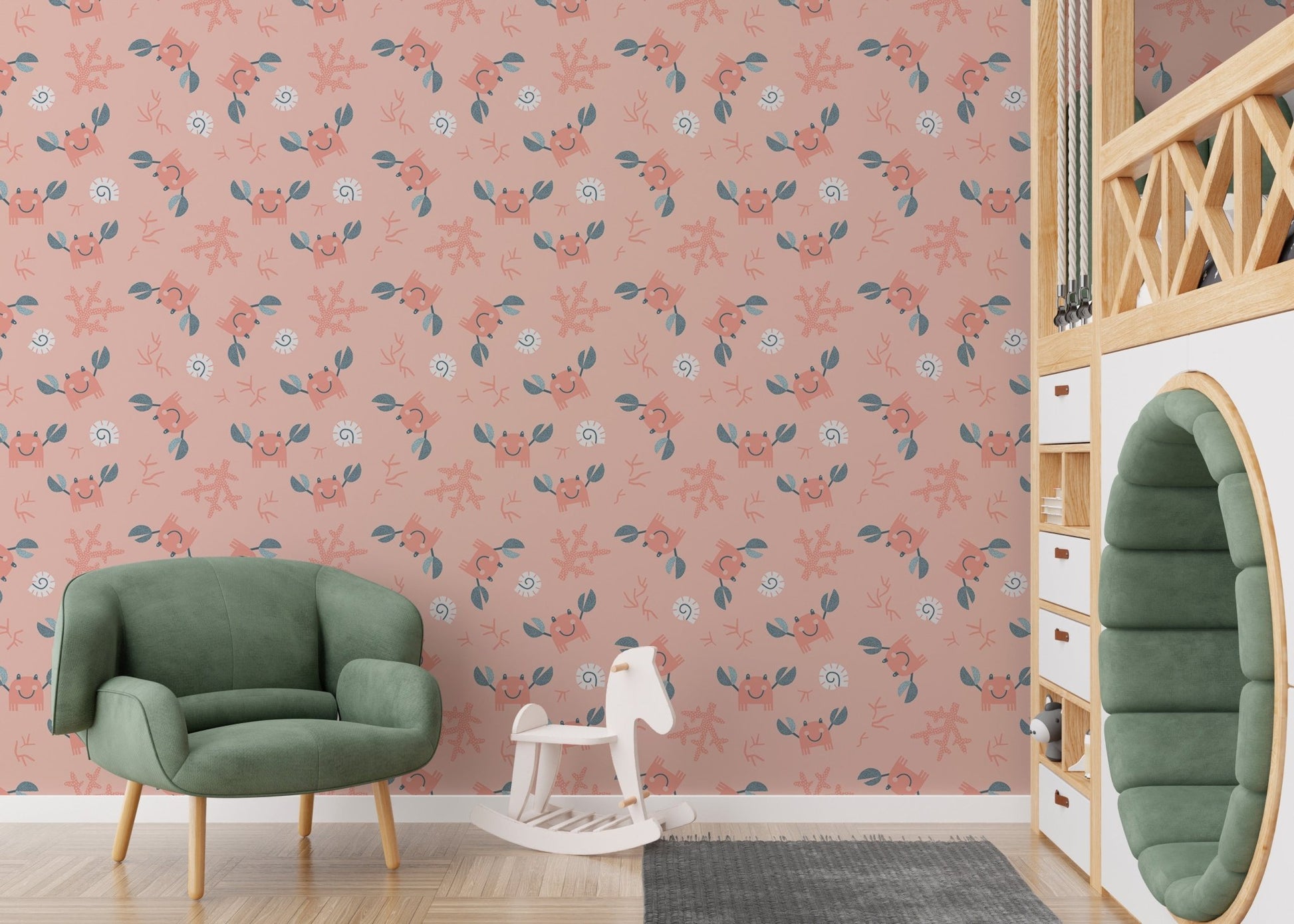 Marine themed wallpaper with crabs and shells in a playroom with a green chair.