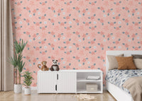 Crab and sea shell pattern wallpaper in a bedroom with a white storage unit.