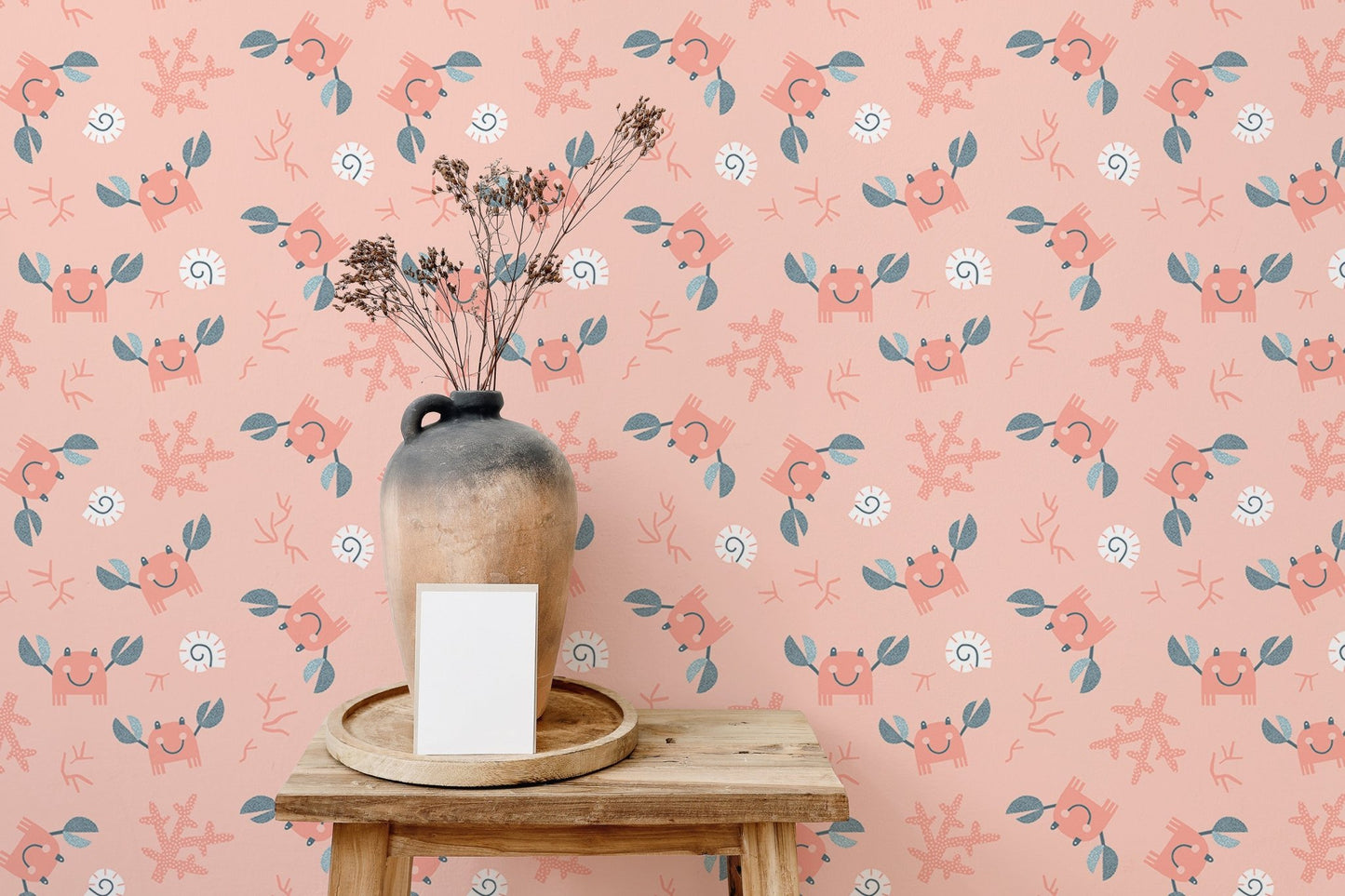Cute crab sea shells pink pastel color wallpaper used as a feature wall in a lounge.