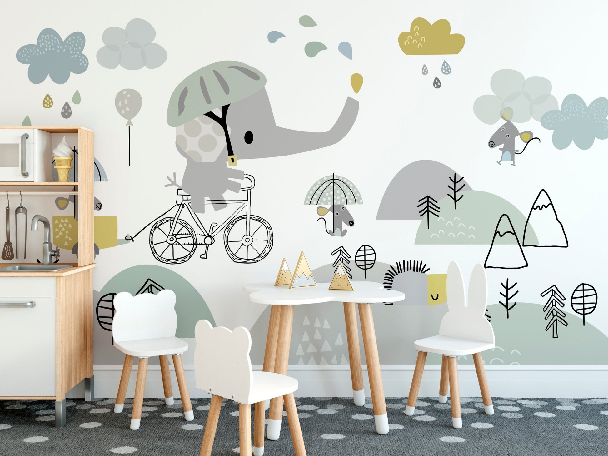Daycare activity room with white chairs and grey elephant bicycle wall mural.