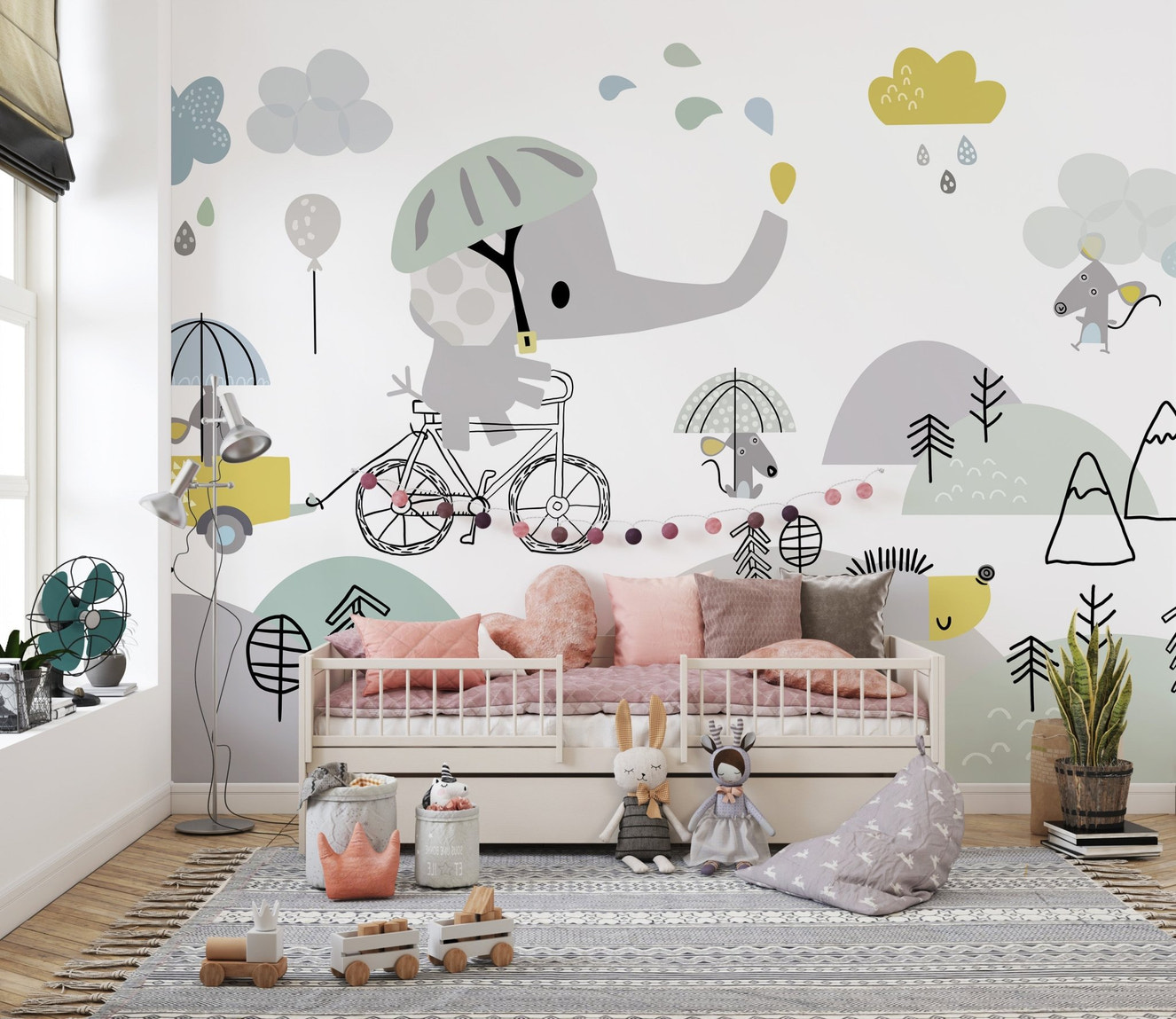 Cute elephant on bicycle kids wall mural in a nursery with a white wooden bed.