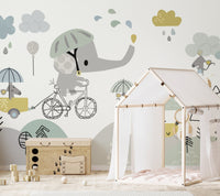 Child bedroom with a house-shaped bed frame and cartoon elephant wall mural.