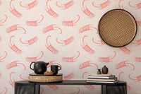 Fun and cute wallpaper with pink cat illustrations in study area.
