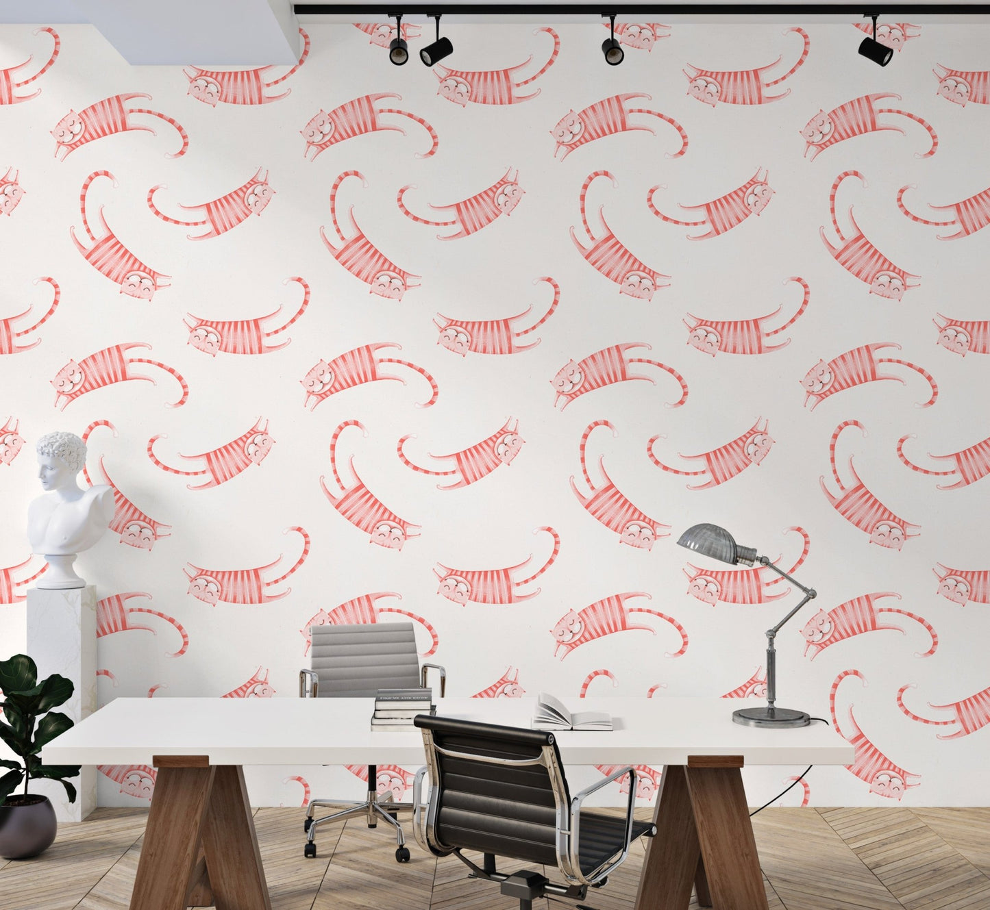 Office workspace with white desk and pink cat pattern wallpaper.