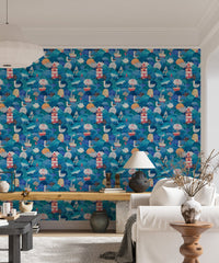 Living area with blue watercolor ship themed wallpaper.