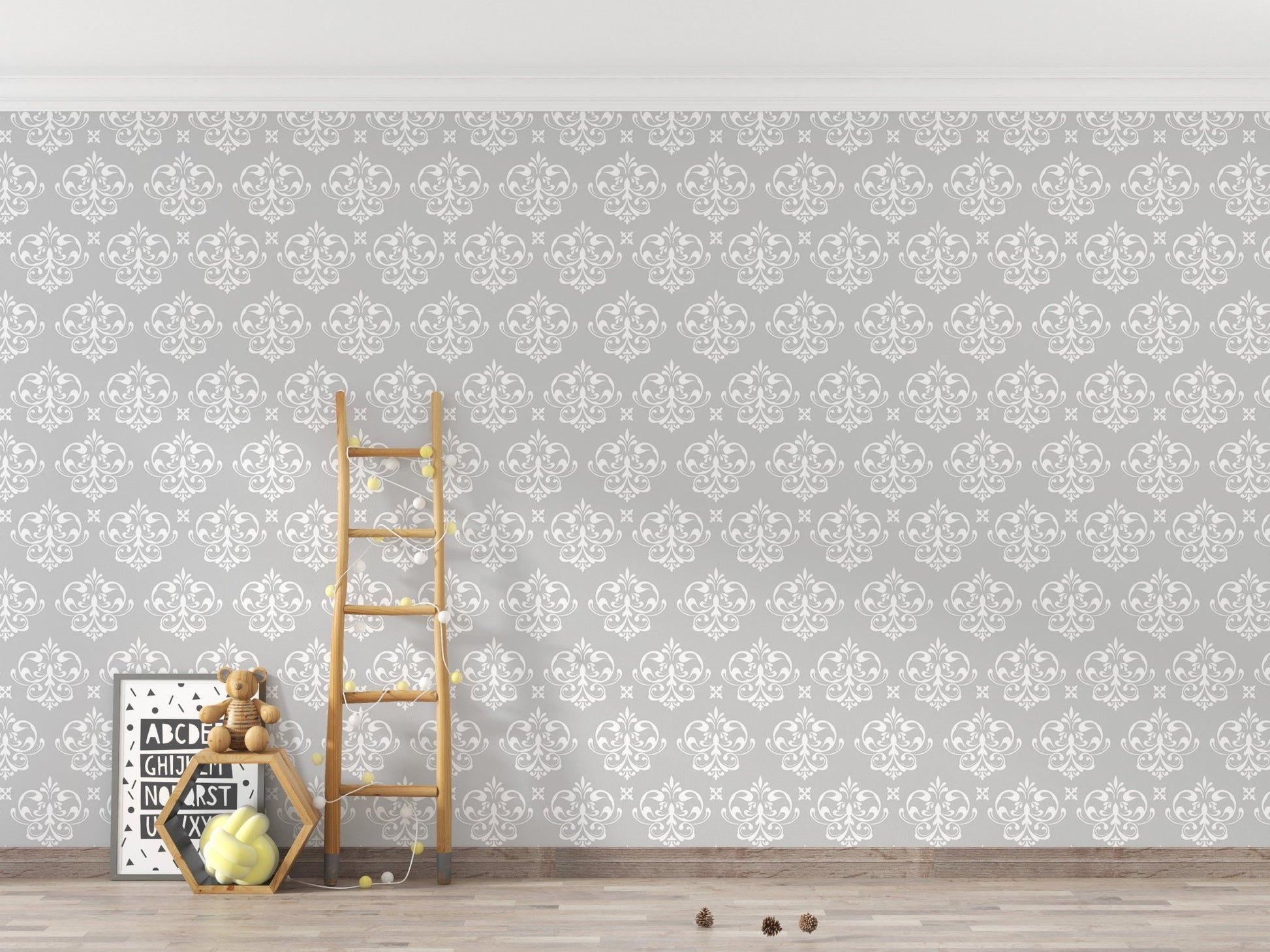 Grey and white damask wallpaper behind a wooden ladder in a minimalist room.