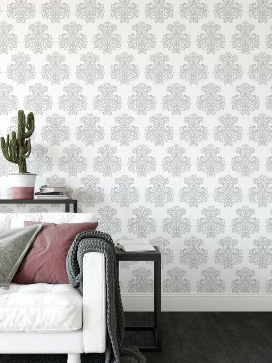 Living room wallpaper featuring a grey and white symmetrical damask print.