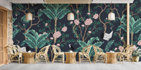 Dark background Green leaves Flower Wall mural in a cafe with rattan chairs and tables.
