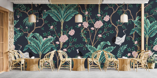 Dark background Green leaves Flower Wall mural in a cafe with rattan chairs and tables.