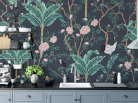 Dark floral wall mural installed as a backsplash in a modern grey kitchen.