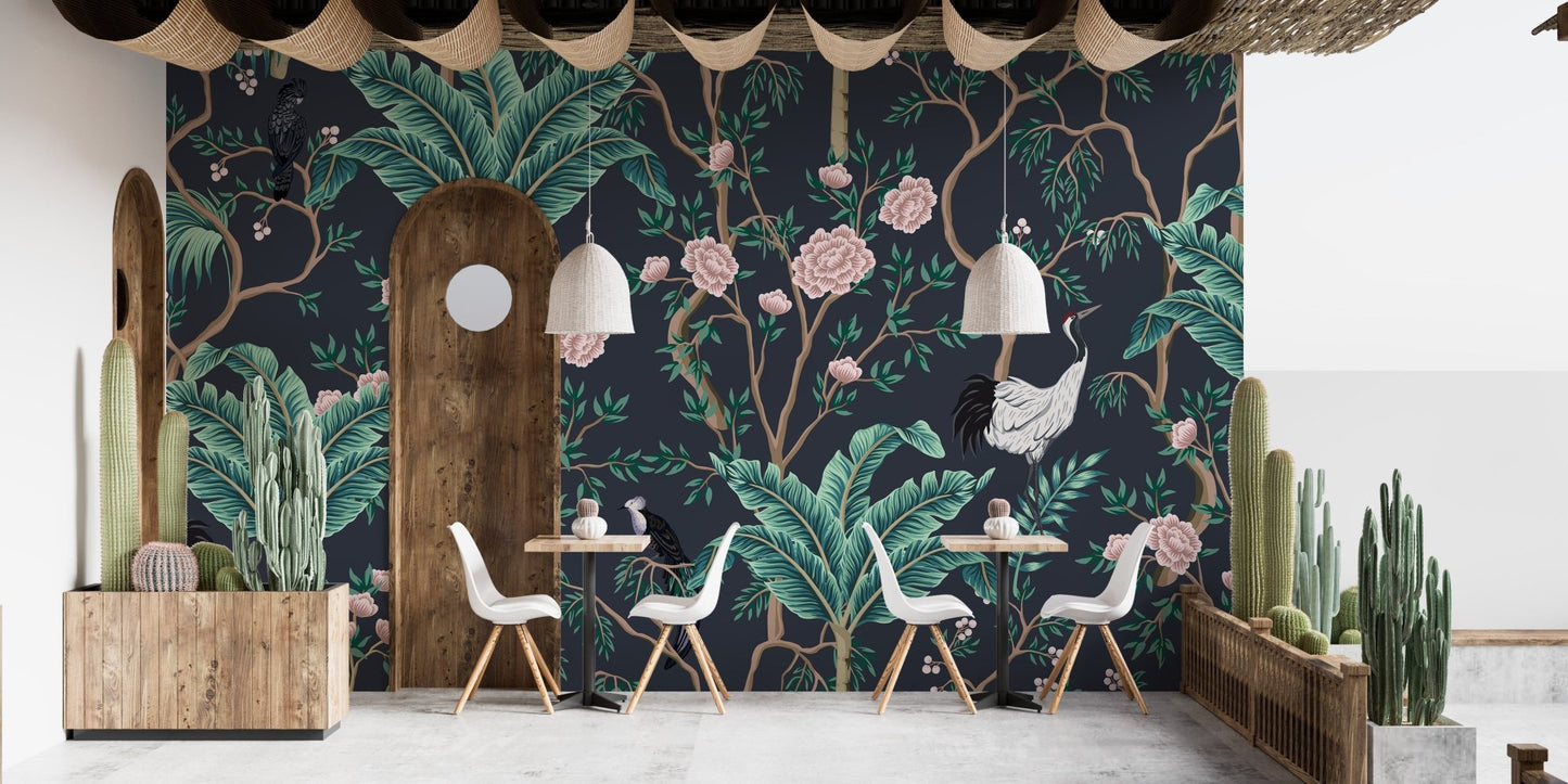 Dark background wall mural with teal foliage in a restaurant with white chairs.